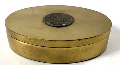 Lot 386 - An oval brass box and cover, the cover inlaid...