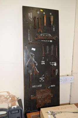 Lot 747 - Display board featuring locks and various tools