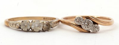 Lot 49 - Two gemset rings: to include a three stone...