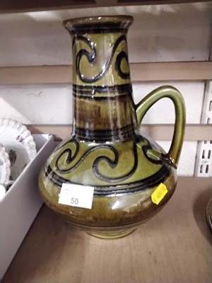 Lot 50 - An Austrian green glazed vase with handle