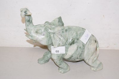 Lot 68 - A carved stone elephant