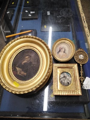 Lot 134 - A small oval portrait of a gentleman, oil on...