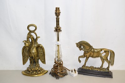 Lot 27 - Two cast brass doorstops, one formed as a...