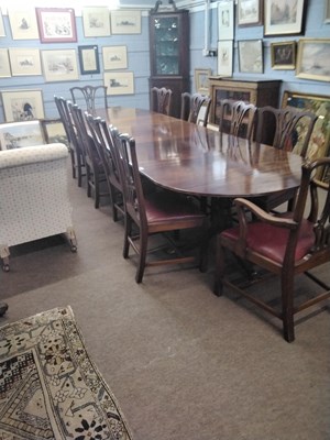 Lot 563 - A Georgian Revival mahogany triple pedestal...