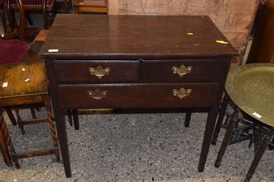 Lot 323 - A Georgian stained oak three drawer side table