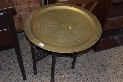 Lot 324 - A brass tray top Benares table