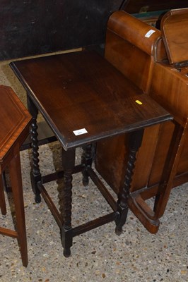 Lot 328 - A 1930's oak lamp table on barley twist legs
