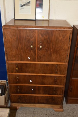 Lot 346 - An Art Deco style walnut veneered tallboy cabinet