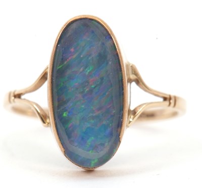 Lot 9 - A 9ct opal triplet ring, the oval triplet in...