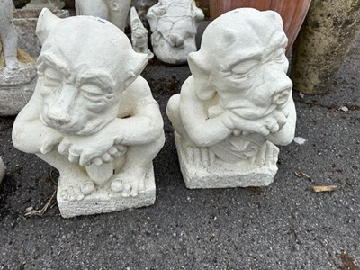 Lot 266 - Pair of composition figures of crouching...