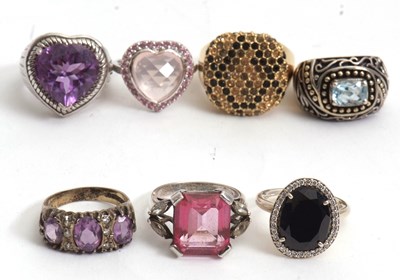 Lot 219 - A group of seven rings, including topaz,...