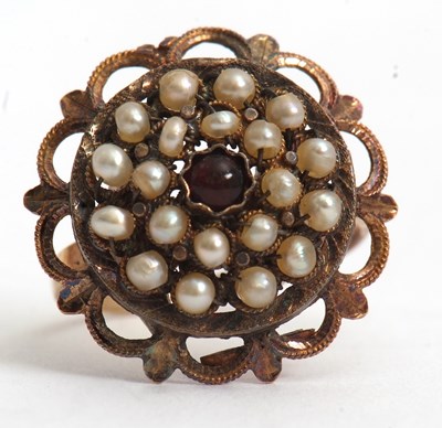Lot 69 - A seed pearl and garnet ring, the central...