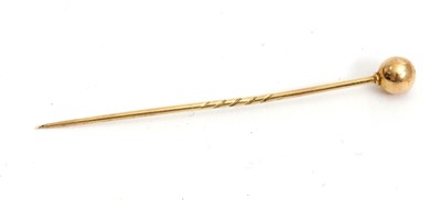 Lot 151 - An unmarked yellow metal stock pin, (tests as...