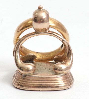 Lot 123 - A fob and 22ct wedding band, the fob set with...