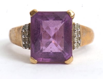 Lot 66 - A 9ct amethyst and diamond ring, the central...
