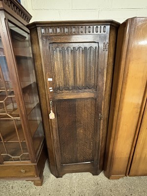 Lot 256 - 20th Century oak wardrobe with linen fold...