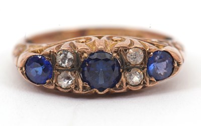 Lot 19 - A 9ct ring, with alternating blue and white...