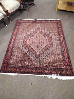 Lot 571 - A 20th Century Middle Eastern wool floor rug...