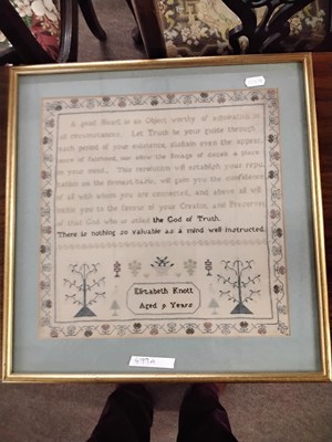 Lot 479A - A needlework sampler decorated with a stylised...