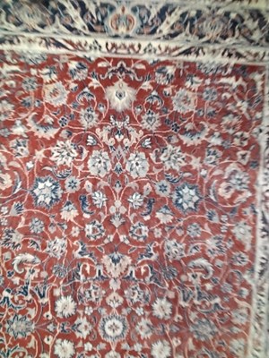 Lot 579 - A 20th Century small Kashan type floor rug...