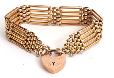 Lot 144 - A gate bracelet, 15mm deep, 18cm long, with...
