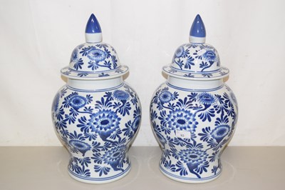Lot 92 - Pair of modern covered blue and white vases