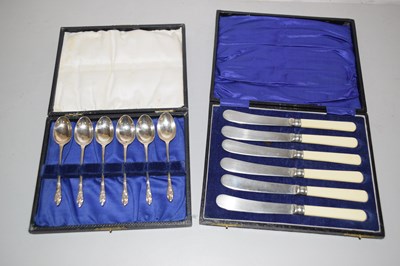 Lot 126 - A case of butter knives with simulated ivory...