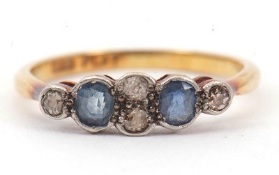 Lot 29 - An 18ct and platinum sapphire and diamond ring,...