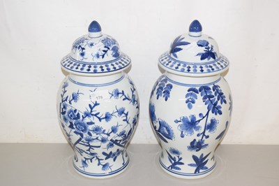 Lot 178 - Pair of reproduction blue and white covered vases