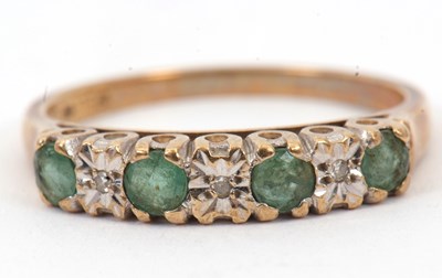 Lot 58 - A 9ct emerald and diamond highlight ring, with...