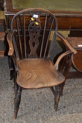 Lot 292 - A 19th Century wheel back armchair