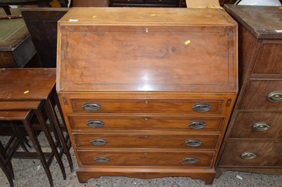 Lot 295 - A reproduction yew wood veneered bureau