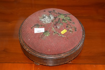 Lot 303 - A bead work covered footstool