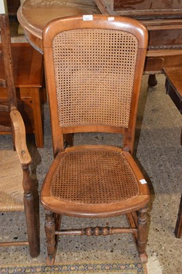 Lot 309 - A late 19th Century cane seat and back rocking...