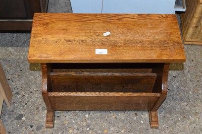 Lot 322 - An oak magazine rack