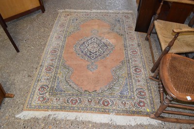 Lot 323 - A 20th Century Turkish floor rug of small...