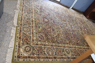 Lot 325 - A large 20th Century machine made floor rug...