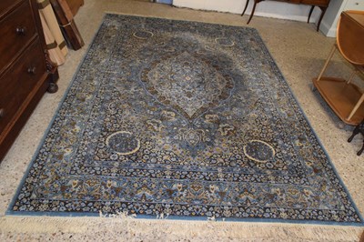Lot 326 - A 20th Century machine made floor rug...