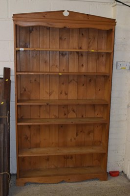 Lot 240 - A pine open front bookcase