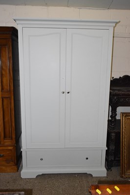 Lot 248 - A cream finish two door wardrobe