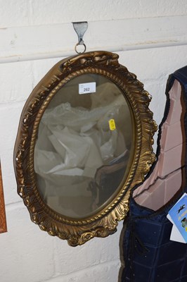 Lot 262 - An oval wall mirror