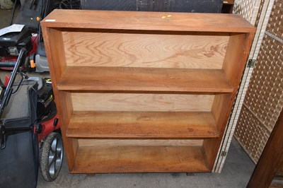 Lot 795 - An oak open front bookcase
