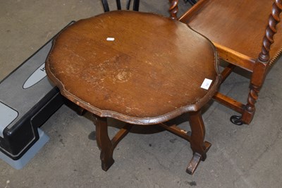 Lot 797 - A small oak coffee table with oval top