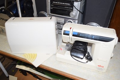 Lot 719 - An Elna sewing machine, cased
