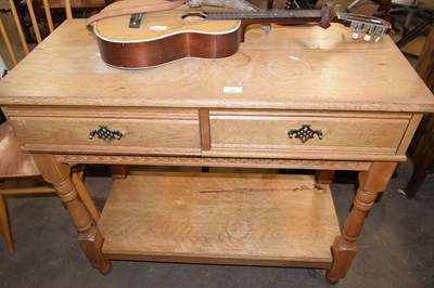 Lot 750 - Oak side table with two drawers and shel below