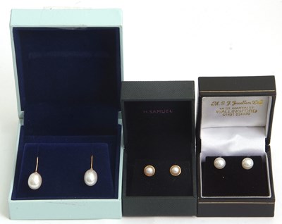 Lot 230 - Three pairs of cultured pearl earrings: to...
