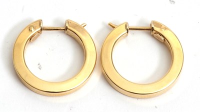 Lot 145 - A pair of 18ct earhoops, stamped 750 with...