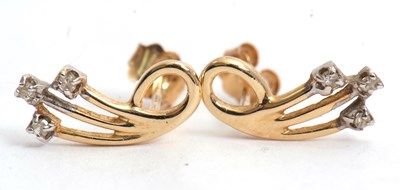 Lot 97 - A pair of diamond earrings, with three looped...