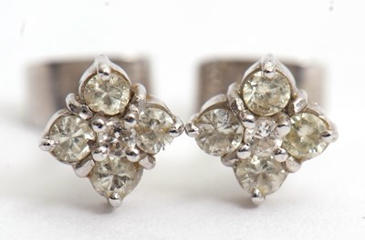 Lot 91 - A pair of 18ct diamond earstuds, with a...