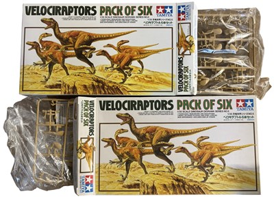 Lot 228 - A pair of boxed Tamiya Velociraptor building...